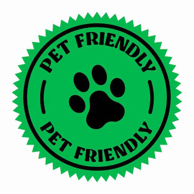 A green circular badge with a black paw print in the center and the words "PET FRIENDLY" written above and below the paw.
